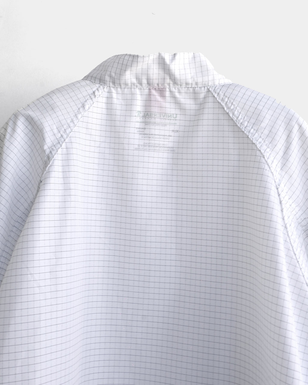 UNIVERSAL Rip-Stop Rain Coat - Grid