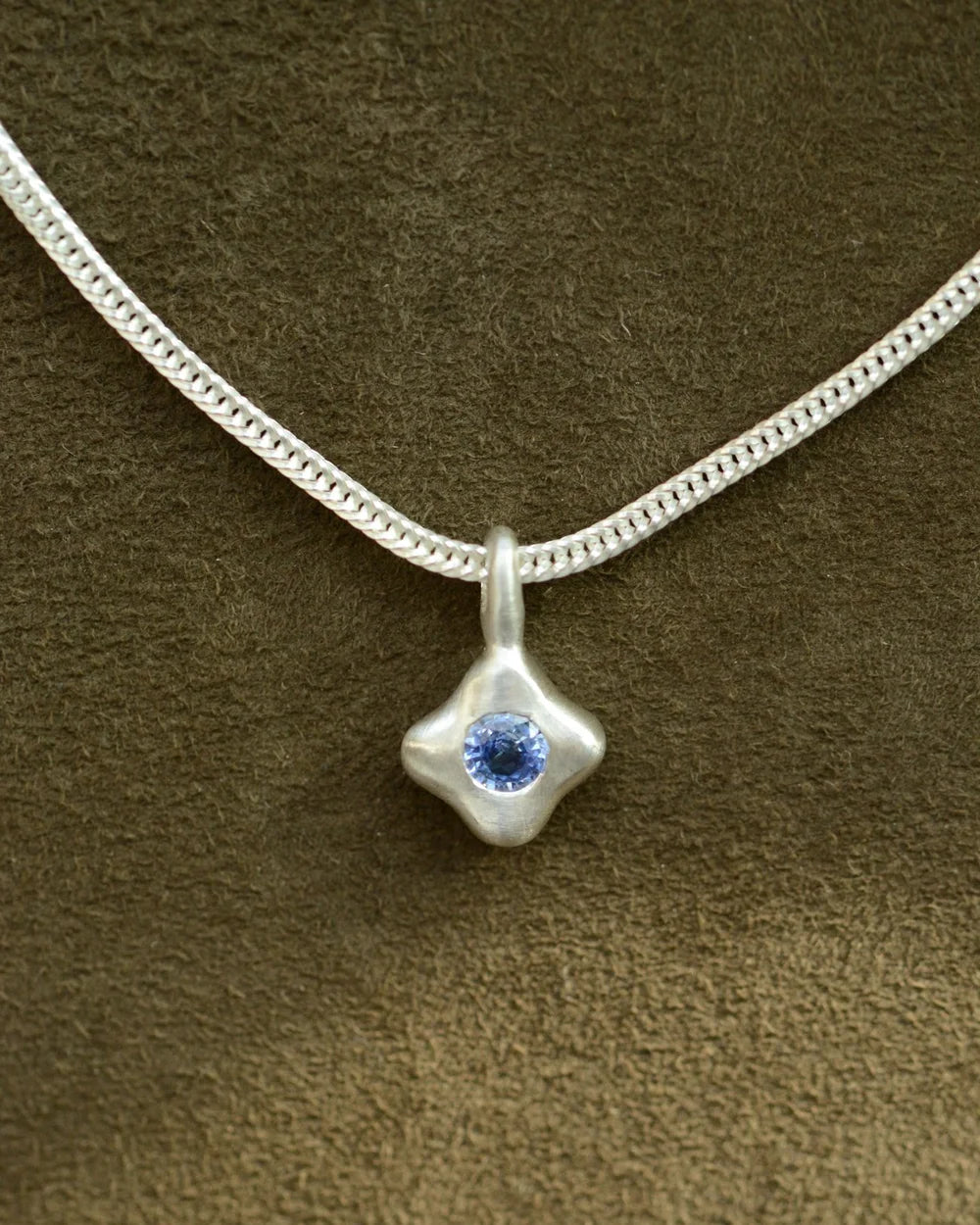 "Dunton Ellerkamp" Blue Sapphire and Silver Owen Solitaire Pendant